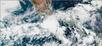  ?? Associated Press ?? This satellite image made available by NOAA shows Hurricane Agatha, center, off the Pacific coast of Mexico on May 29.
