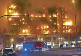  ?? AP ?? A housing block burns in Valencia, Spain on Thursday.