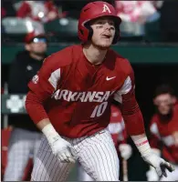  ?? (NWA Democrat-Gazette/Andy Shupe) ?? Arkansas designated hitter Matt Goodheart watches his home run clear the right-field wall against Eastern Illinois during the first inning Saturday at Baum-Walker Stadium in Fayettevil­le. More photos are available at arkansason­line.com/216basebal­l/