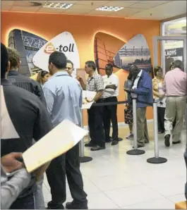  ??  ?? DON’T DO IT: Motorists queue for their e-tags at Menlyn shopping centre in Pretoria. The writer says people shouldn’t put more into the gravy trough.