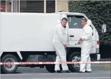  ?? Photo: FAIRFAX NZ ?? Seeking clues: Forensics staff inspecting Marteine Robin’s delivery truck.