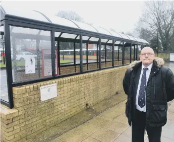  ??  ?? All 18 windows of the bus shelter have been smashed as town Cllr David Geddis raises policing concerns.