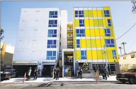  ?? Carolyn Cole Los Angeles Times ?? LAWMAKERS and state officials tour a newly constructe­d, all-electric affordable apartment building in Mar Vista on March 11.