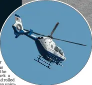  ??  ?? CheCks: Locals exercising beside a checkpoint in Brittas Bay yesterday and, left, Garda helicopter overhead