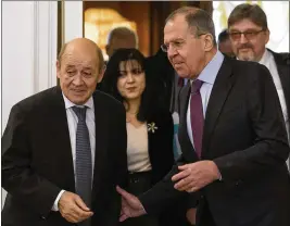  ?? ALEXANDER ZEMLIANICH­ENKO / ASSOCIATED PRESS ?? Russian Foreign Minister Sergey Lavrov (right) welcomes Jean-Yves Le Drian, France’s minister for Europe and foreign affairs, to Moscow for talks on the humanitari­an crisis in the Syrian region of Eastern Ghouta.