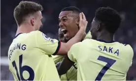  ?? Ham. Photograph: Ian Walton/AP ?? Arsenal's Gabriel Magalhães (centre) celebrates after scoring his side’s second goal against West