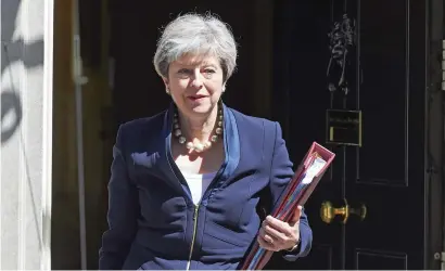  ??  ?? Theresa May leaves No 10 Downing St for Prime Minister’s Question Time at Westminste­r, in London. —