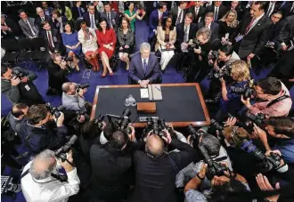  ?? Pablo Martinez Monsivais / Associated Press ?? All eyes — and a few cameras — are on Supreme Court nominee Neil Gorsuch as he arrives Monday on Capitol Hill for his confirmati­on hearing before the Senate Judiciary Committee.