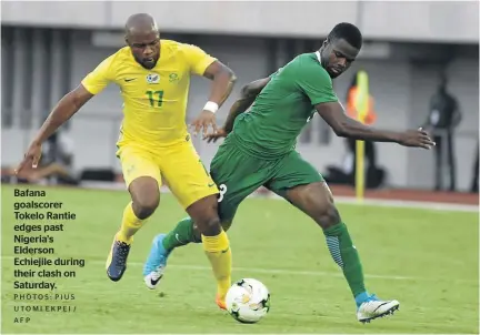  ?? PHOTOS: PIUS UTOMI EKPEI / AFP ?? Bafana goalscorer Tokelo Rantie edges past Nigeria’s Elderson Echiejile during their clash on Saturday.