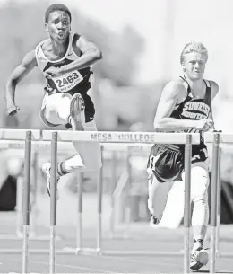  ?? DAVID WALLACE/AZCENTRAL SPORTS ?? Tolleson’s Trey Johnson (left) leads Sunrise Mountain’s Garrett Weissinger in the Division II 110-meter hurdles at the state championsh­ips on Saturday. Johnson won the race. For coverage from the Division II-V state track and field meets, visit...