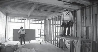  ?? Andy Cross, The Denver Post ?? Crews work inside the Limelight Hotel at the base of Snowmass Village. The hotel is a key component of a 10-year, $600 million plan to finish a project that has languished for years.