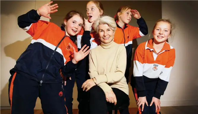  ?? ?? Robyn Nevin in 2013, surrounded by Grade 5 pupils at The Fahan School, in Sandy Bay, when the actor returned to deliver a keynote speech at the school, which she credits for nurturing her career. Picture: Luke Bowden