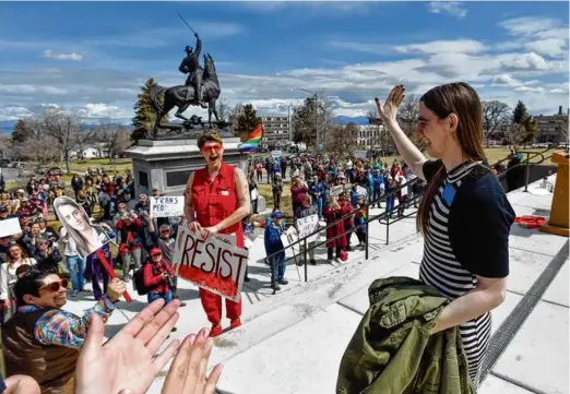  ?? THOM BRIDGE/INDEPENDEN­T RECORD VIA AP ?? State Representa­tive Zooey Zephyr, a Democrat who has been banned from the floor of the House, waved to supporters during a rally at the Montana Capitol in Helena last Monday.