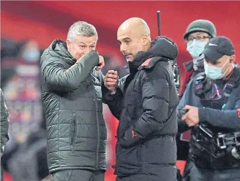  ?? AFP ?? Manchester United manager Ole Gunnar Solskjaer, left, speaks with Manchester City boss Pep Guardiola after their Premier League match last month.