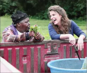  ?? WASHINGTON POST TED RICHARDSON/THE ?? Vivian Howard (right) talks with Lillie Hardy during a visit to Brothers Farm, one of Howard’s produce suppliers, in her hometown of Kinston, North Carolina.