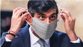  ??  ?? Pressure: Chancellor to stop wearing mask ‘as soon as possible’