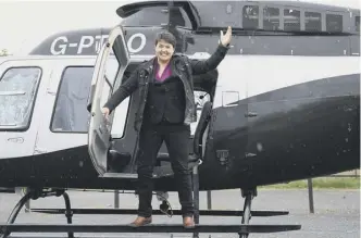  ??  ?? Clockwise from main: in the last frantic days of campaignin­g Nicola Sturgeon tours Scotland by helicopter as does Ruth Davidson on a trip to Inverurie; Tim Farron makes sandwiches for voters during a visit to a cafe in Edinburgh; and a Labour poster...