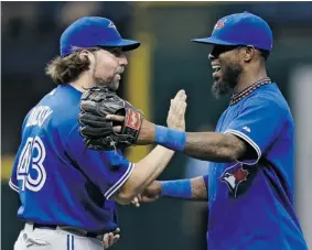  ?? CHRIS O’MEARA /The Associated Press file photo ?? Toronto Blue Jays’ R.A. Dickey, left, celebratin­g with shortstop Jose Reyes after a win in
2013, was one of just two pitchers who made more than 20 starts last season.