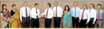  ??  ?? Picture shows the CEO of Union Bank, Anil Amarasuriy­a and Director/CEO of AIA, Shah Rouf (right) shaking hands soon after signing the MOU, They are flanked by AIA's Director, Partnershi­ps, Amal Perera, AGM Bancassura­nce Operations, Tamara...