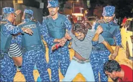  ?? AP ?? Maldivian police officers detain an opposition protestor demanding the release of political prisoners during a protest in Male on Friday.