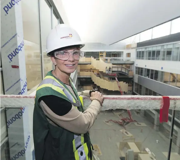  ?? GREG SOUTHAM ?? College president Jodi Abbott proudly shows off the new Singhmar Centre now under constructi­on at NorQuest College. The school, which has been leasing scattered spaces for years, will soon be able to provide students with the feeling of a real college...