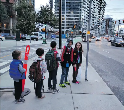  ?? COURTESY ADRIAN CROOK ?? Adrian Crook, a Vancouver father who is car-free, has been told by the B.C. Ministry of Children that he can no allow his children to take a city bus to school on their own. longer