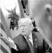  ?? BRENDAN SMIALOWSKI/GETTY-AFP ?? Vice President Mike Pence listens while President Donald Trump speaks Thursday.