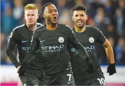 ?? Reuters ?? Manchester City’s Raheem Sterling celebrates after scoring a goal against Huddersfie­ld Town during their English Premier League match on Sunday.