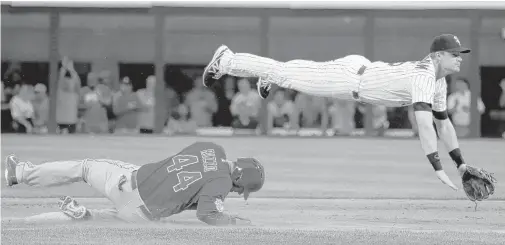  ?? | CHARLES REX ARBOGAST/AP ?? White Sox second baseman Gordon Beckham, forcing Anthony Rizzo at second on a double play in the first inning, has hit well against the Cubs.