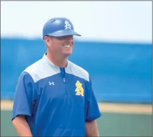  ?? Submitted photo ?? REGIONAL HOSTS: Southern Arkansas head baseball coach Justin Pettigrew leaves the field after an inning against Augustana on May 21 at Walker Stadium at Goodheart Field in Magnolia. Photo by Brenna Johnson, courtesy of Southern Arkansas Athletics...