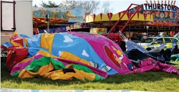  ??  ?? Blown away: Bouncy castle was brought back to the funfair after the crash