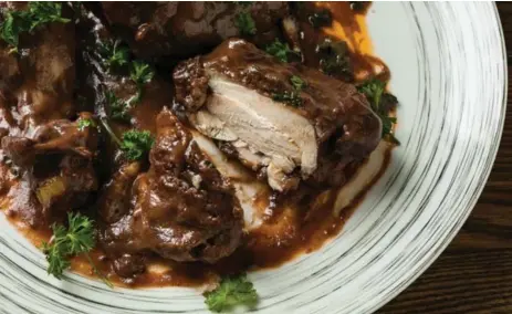  ?? GORAN KOSANOVIC/FOR THE WASHINGTON POST ?? Coq au vin (chicken in red wine): Surprising­ly, the approaches required equal time: 2 hours and 5 minutes. It was much crispier done in a Dutch oven.