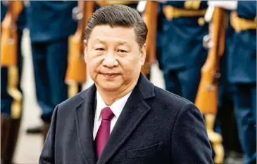  ?? FRED DUFOUR/AFP ?? China’s President Xi Jinping reviews paramilita­ry guards with Myanmar’s President Htin Kyaw at a welcome ceremony at the Great Hall of People in Beijing on April 10.