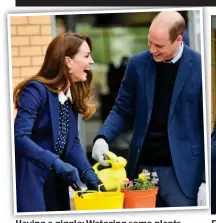  ??  ?? Having a giggle: Watering some plants