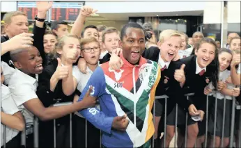  ?? PICTURES: CHRIS COLLINGRID­GE ?? Ntando Mahlangu, 14, silver medallist in the 200m at the Rio Paralympic­s, meets some of his biggest fans during the welcoming ceremony for Team South Africa at at OR Tambo airport yesterday.