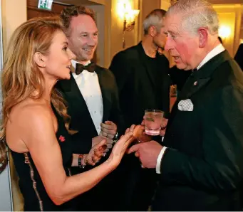  ??  ?? Above: Geri Horner and husband Christian with Prince Charles last night. Right: With Spice Girls