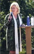  ??  ?? The Rev. Shannon White leads the community in prayers and reflection at Our Lady of Fatima in Wilton.