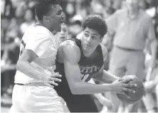  ?? Photos by Paul Kuroda / Special to The Chronicle ?? St. Joseph’s Isaiah Mellor defends against Mitty’s Riley Grigsby in their Northern California Open Division game.