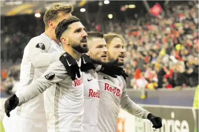  ?? BILD: SN/AP ?? Munas Dabbur, Fredrik Gulbrandse­n, Valon Berisha und Andreas Ulmer Leistungen dafür, dass in Salzburg eine Fußball-Euphorie entfacht wurde. (v. l.) sorgten mit ihren