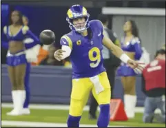  ?? KEVIN REECE/Special to the Valley Press ?? Rams quarterbac­k Matthew Stafford pitches the ball during Thursday night’s game against the Saints at SoFi Stadium in Inglewood. Stafford passed for 328 yards and two touchdowns in the Rams’ 3022 victory over the Saints.