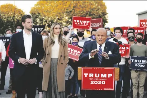  ?? ASSOCIATED PRESS ?? RUDY GIULIANI, A LAWYER FOR PRESIDENT DONALD TRUMP, speaks during a news conference on legal challenges to vote counting in Pennsylvan­ia, on Wednesday in Philadelph­ia. At left are Eric Trump, son of President Trump, and his wife Lara Trump.