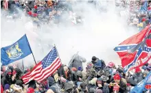  ?? REUTERS ?? Tear gas is released into a crowd of protesters during clashes with Capitol police at a rally to contest the certificat­ion of the 2020 U.S. presidenti­al election results by the U.S. Congress, at the U.S. Capitol Building in Washington on Jan. 6.