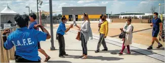  ??  ?? People from all over the metro Atlanta line up to enter the Mercedes-benz Stadium Community Vaccinatio­n Center to receive their vaccinatio­n shots Tuesday.