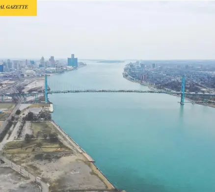  ?? GREGORY SHAMUS / GETTY IMAGES ?? A view of the Ambassador Bridge between Windsor and Detroit. Truck drivers, fishermen, soldiers, airline crew, health-care workers and critical-infrastruc­ture technician­s are among those exempt from COVID-19 isolation rules when crossing the border into Canada.