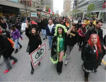  ?? STEVE RUSSELL/TORONTO STAR ?? At Saturday’s Toronto Global Marijuana march, participan­ts were protesting the recent pot dispensary raids by city police. The marijuana marches took place in dozens of cities worldwide.