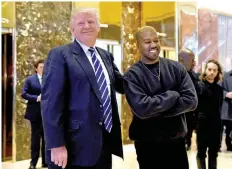  ?? —AFP ?? In this file photo taken on December 13, 2016 singer Kanye West and President-elect Donald Trump speak with the press after their meetings at Trump Tower in New York.