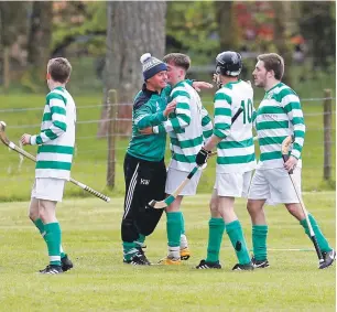  ??  ?? Oban Celtic manager Kenny Wotherspoo­n celebrates with his players after their thrilling 5- 4 win over Inveraray. Photo: Stephen Lawson