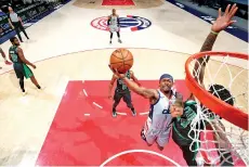  ?? - AFP photo ?? Beal #3 shoots the ball against the Boston Celtics.