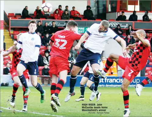  ?? PICTURE: Richard Parkes ?? HIGH RISER: John McCombe heads home Macclesfie­ld’s winner