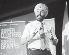 ?? FRED CHARTRAND THE CANADIAN PRESS ?? Navdeep Bains, Minister of Innovation, Science and Economic Developmen­t announces proposals under the $950-million Innovation Superclust­ers Initiative in Ottawa in February.